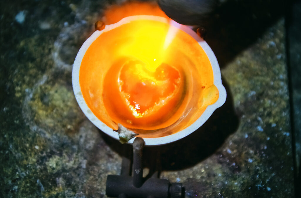 crucible experience concept Melted in a crucible precious metal gold or silver in the form of a hot heart
